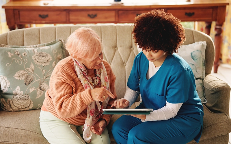 medical staff with patient at home
